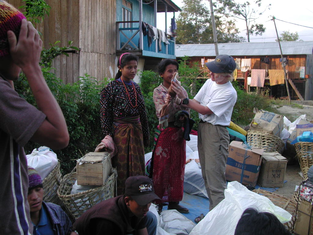 Wanda Vivequin helping with the distribution of warm clothing to porters before a trek
