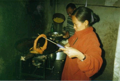 Kul's sister helping with cooking in the teashop