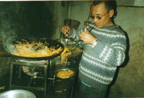 Kul cooking in his teashop