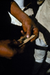 Rolling up a cigarette, Rejane Belanger, Australia