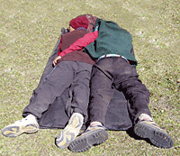 trekking porters resting in the sun